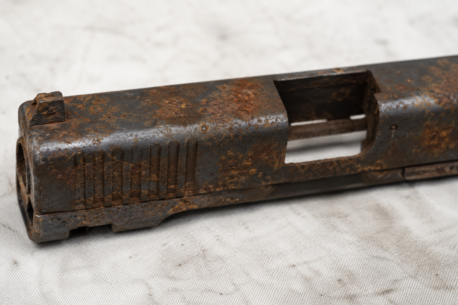 Rust on firearm slide and metal components